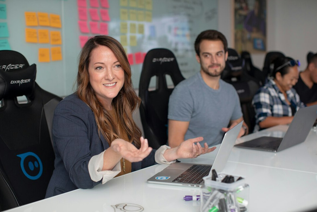 person coding at desk
