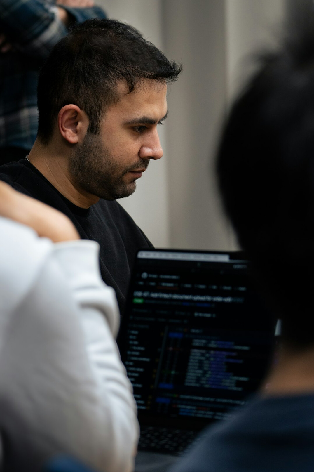 diverse team collaborating on code