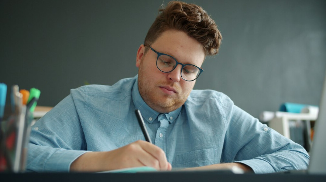 person thinking deeply at desk
